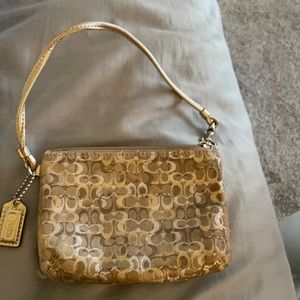 Gold coach wristlet